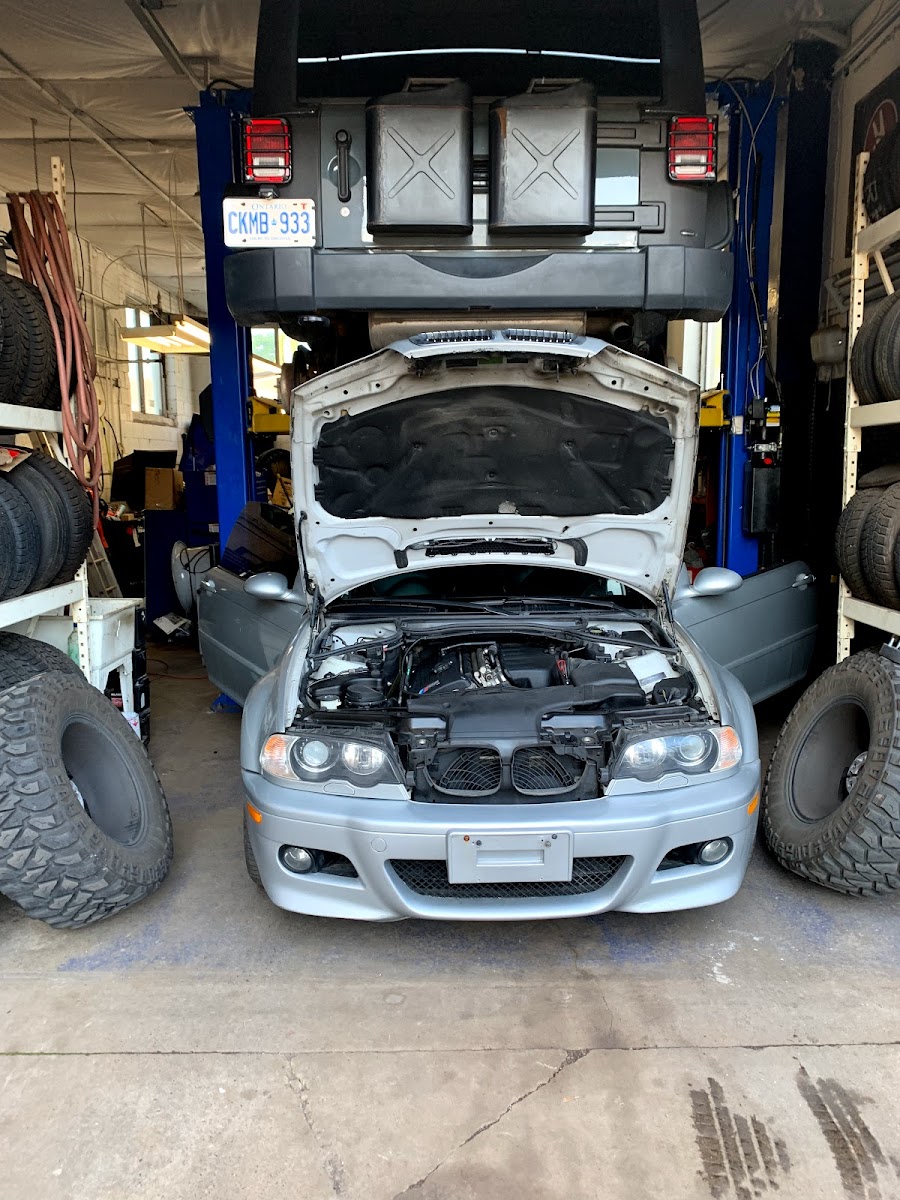 Vehicle on the lift inside Mike&rsquo;s Auto Repair